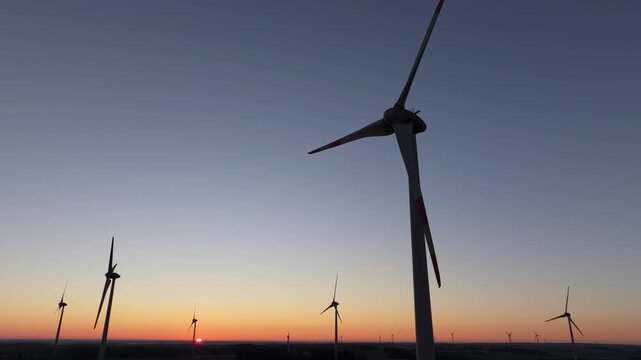 Wind turbines generating power, wind farm, aerial view