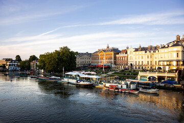Richmond upon Thames riverside with people and boats during early evening