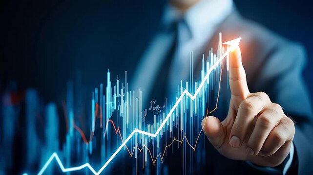 Businessman pointing at upward graph
