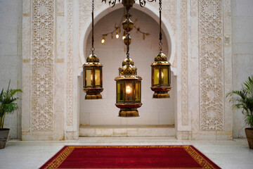 Ancient stone architecture and golden decorations adorn the interior of the holy sepulchre church, featuring an ornate entrance arch and religious art within this historic landmark temple