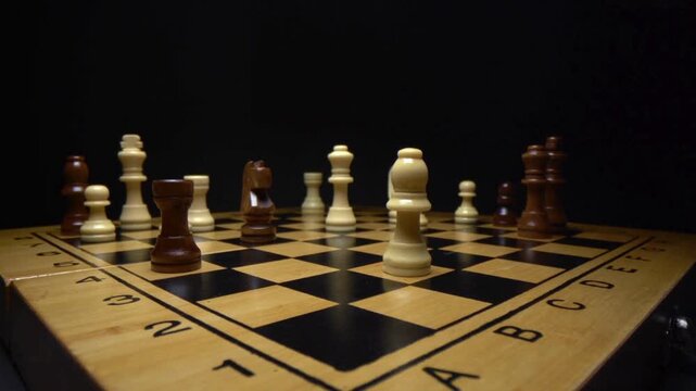 Dimly lit chessboard with alternating timber squares and scattered white and dark pieces. Mood glow
