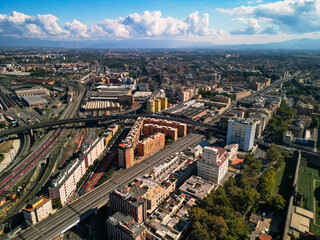 Obraz premium Aerial high angle view of complex highway and railway interchange in Rome, Italy. Infrastructure and urban transportation hub in broad daylight.