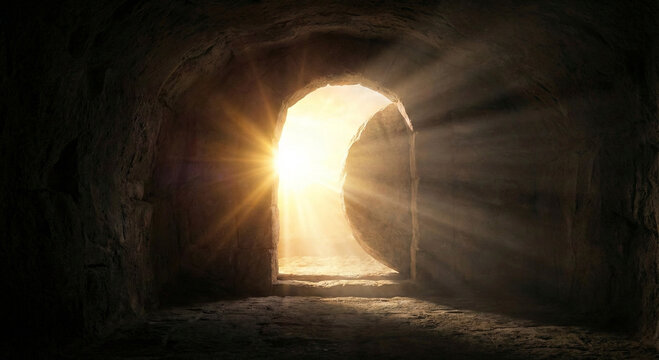 Resurrection of Jesus Christ concept with empty tomb stone rolled away and bright light beams from outside