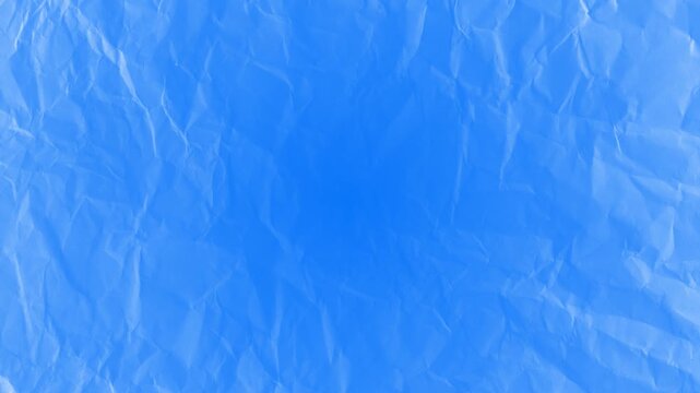 Crumpled Blue Paper Texture Abstract Background Loop.High quality motion background featuring a wrinkled blue paper texture with organic creases