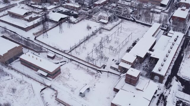 Aerial view of a power substation at an aluminium factory during winter