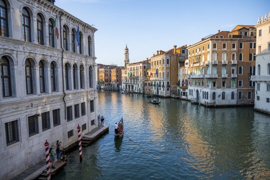 Evening atmosphere on the Grand Canal with gondoliers, view from the Rialto Bridge, Venice, Veneto, Italy