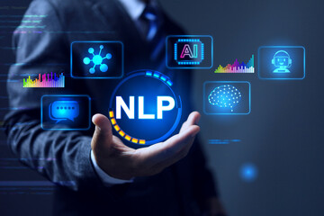 NLP Natural Language Processing concept with businessman holding info graphic focusing on communication and development computer AI using machine learning to bridge human communication