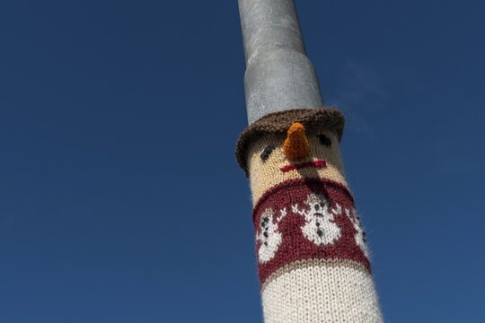Knitting art or guerrilla knitting, lamppost, Bl&ouml;ndu&oacute;s, Nor&eth;urland, Iceland