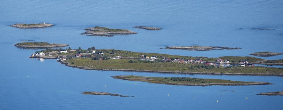 Rocky islands with colourful houses, sea with archipelago islands, Ulv&aring;gsundet, Vester&aring;len, Norway