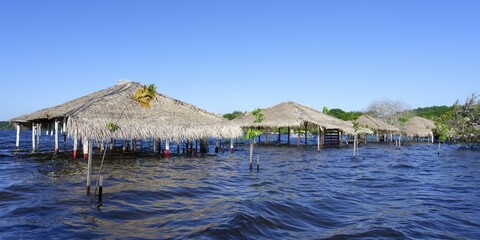 Flooded beach huts, Alter do Chao Beach, Tapajos River, Para state, Brazil