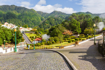 Wide landscape of Caldeiras das Furnas geothermal field with steam vents and boiling mud in S&atilde;o Miguel, Azores.