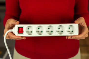 White european power strip with six schuko outlets and Illuminated on-off switch Isolated on white background for home office and electrical connectivity needs.