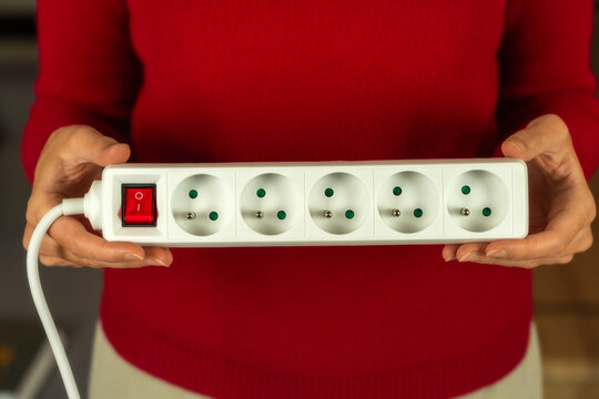 White european power strip with six schuko outlets and Illuminated on-off switch Isolated on white background for home office and electrical connectivity needs.