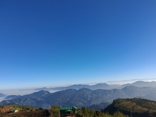 Scenic mountain panorama above the clouds, peaceful nature