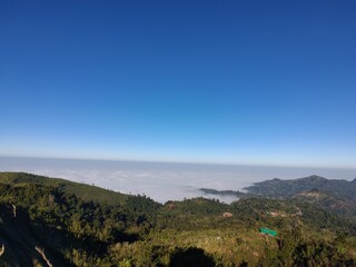 Peaceful mountain scenery above the clouds, high altitude view