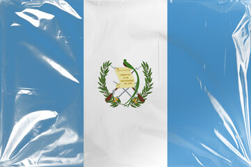 Guatemalan National Flag with Detailed Emblem Under Transparent Wrinkled Plastic Overlay Showing...