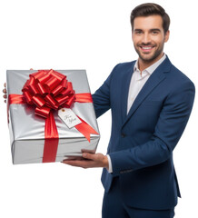 Smiling man in blue suit holds silver gift box with red bow and for you tag