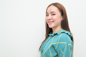 Profile view portrait of a young Asian woman against white background