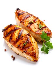 Two grilled chicken breasts on a white background