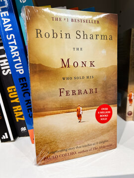 The Monk Who Sold His Ferrari book cover by Robin Sharma on shelf