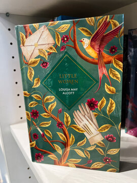 Little Women by Louisa May Alcott on a decorative green book cover with birds and botanical vines
