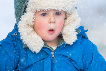 Little Boy is Surprised in His First Time in Snow