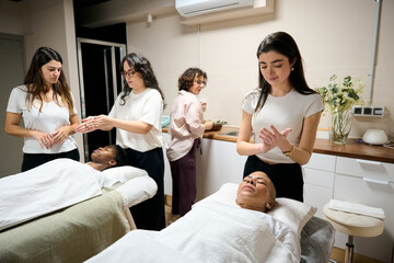 Women engaging in reiki energy healing therapy