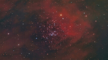 Fototapeta premium Stunning cosmic nebula with a dense star cluster and vibrant red gas clouds in deep space