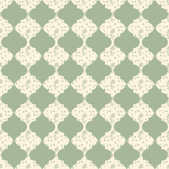Elegant sage green ogee quatrefoil pattern with delicate botanical leaf motifs on neutral cream base. A high-quality seamless vector for luxury wallpaper, textiles, and organic branding © Liubov