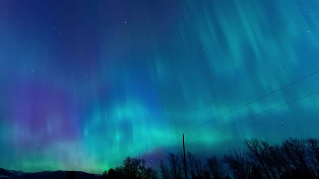 Shimmering northern lights power lines 