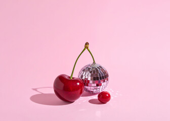 Creative decoration combining juicy cherries and a mirror ball, retro nostalgia, crazy seventies disco party