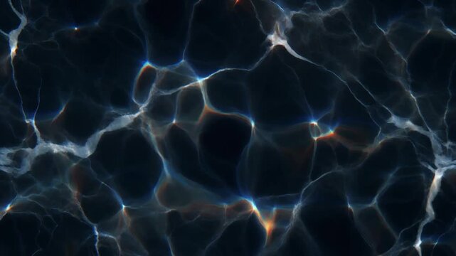 Moving caustic light patterns on dark water