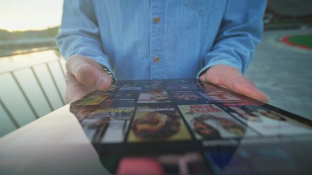 Listening to curated podcasts during sunset drive, Reflective car surface shows podcast thumbnails at sunset