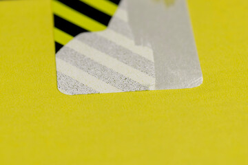 an open package with a torn protective sticker against opening and theft, a torn striped sticker to protect the goods from opening, indicating that the box was opened