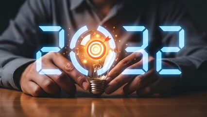 Person holding a glowing lightbulb with the numbers 2032 floating in the air