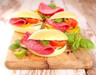 Assorted sandwiches on a wooden board