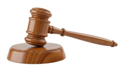 Wooden gavel on a wooden base, a symbol of justice and legal proceedings.