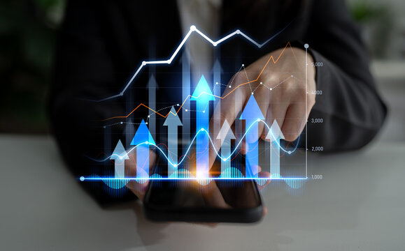A businessman interacts with a smartphone displaying vibrant digital graphs and trends, symbolizing growth, analytics, and modern business strategies. Scalp - Powered by Adobe