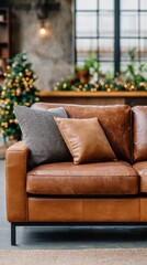 Chairs are placed near a Christmas tree with wrapped gifts in a room that has wooden walls and warm light fixtures
