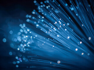Glowing blue fiber optic cables emitting futuristic light signals in a digital communication network background with bokeh effects