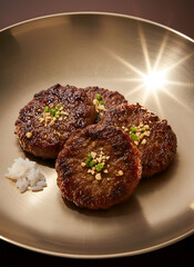 Tteokgalbi &ndash; Traditional Korean Grilled Beef Patty on Dark Background
