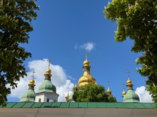 Ukraine Kyiv Saint Sophia church among blooming horse chestnut trees in spring.