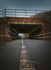 Empty pedestrian tunnel with leading lines