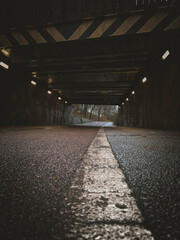 Urban tunnel with wet road and leading line perspective