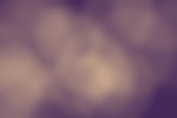Soft blurred background with elegant purple and beige tones creating a serene abstract pattern