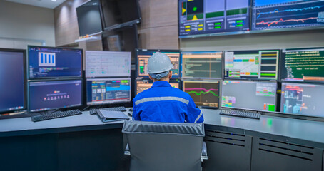 Engineer working at control room, Manager control system, Technician man monitoring program from a lot of monitor.Specialist observes analytics dashboard,operator inspects digital interface