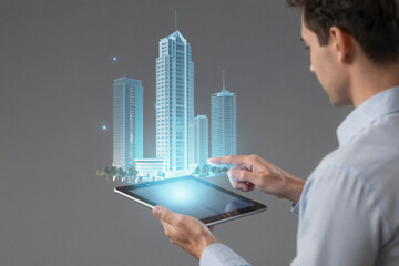 Businessman holding tablet with city hologram. Smart city technology and real estate concept