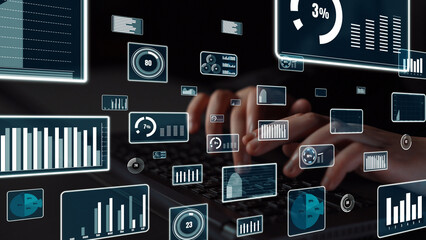 This image depicts an innovative workspace with a focus on data analysis, showcasing various graphs and statistics displayed on a digital interface above a laptop keyboard. Xenic