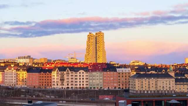 Timelapse of clouds passing by the Norra Tornen, at sunset, Stockholm, Sweden