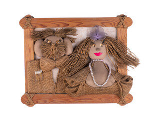 Toy man and woman burlap in frame isolated on white background
